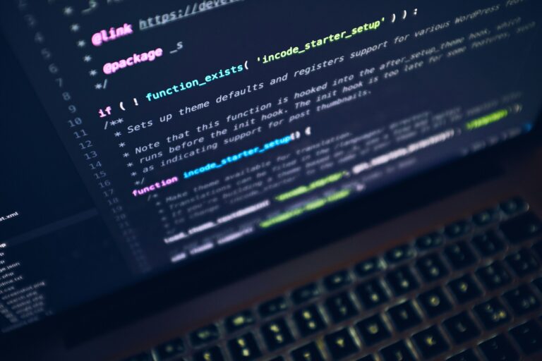 Laptop screen showing source code, representing Android developers preparing for Android Dev Summit 2026 and Android 18