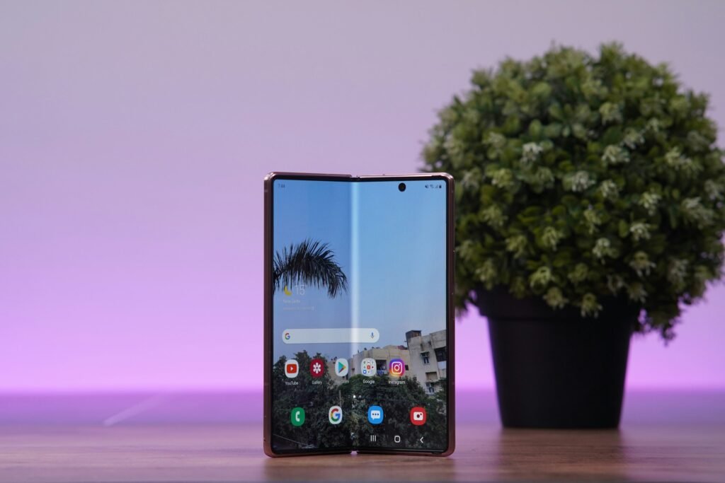 A book-style foldable Android phone standing half-open on a table, the form factor Motorola's rumored Razr Flex would adopt