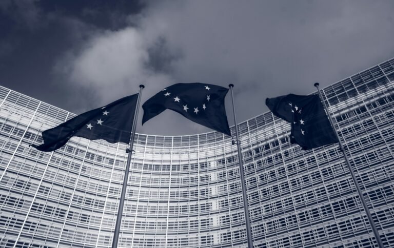 European Union flags outside the European Commission's Berlaymont building in Brussels, where the Android AI rules were issued