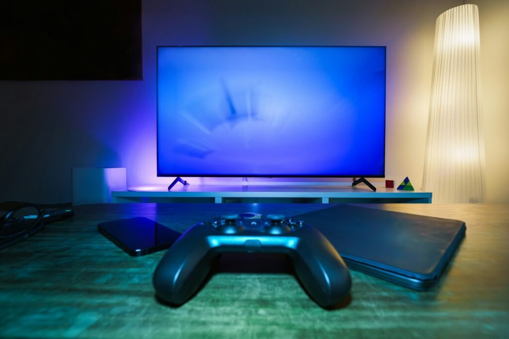 A game controller in front of a TV screen, illustrating Xbox Cloud Gaming coming to TCL Google TV sets