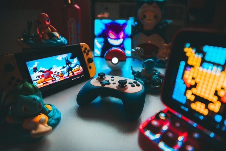 A handheld gaming console and controller on a desk, representing the new wave of dual-screen Android gaming handhelds