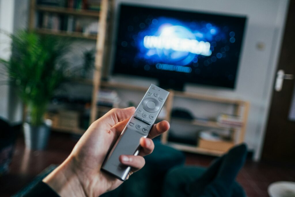 Television on a living room bookshelf, the kind of setup a Google TV Streamer or onn 4K Pro plugs into