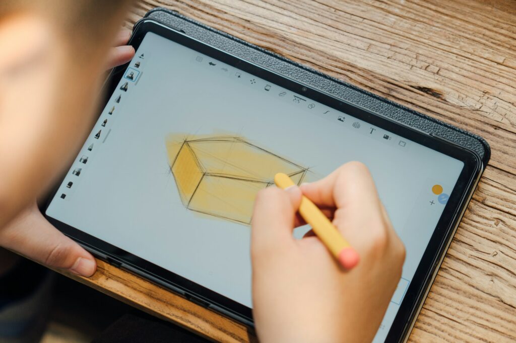 Person holding a large tablet, illustrating Samsung's pricier Galaxy Tab S12+ and Tab S12 Ultra