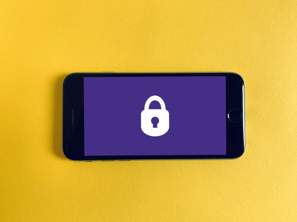 Smartphone with a padlock beside it, illustrating privacy-focused GrapheneOS coming to the Motorola Signature 27