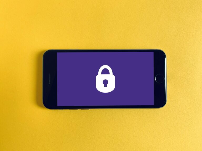 Smartphone with a padlock beside it, illustrating privacy-focused GrapheneOS coming to the Motorola Signature 27