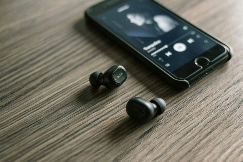 Pair of wireless earbuds with charging case, representing Samsung's upcoming open-ear Galaxy Buds On