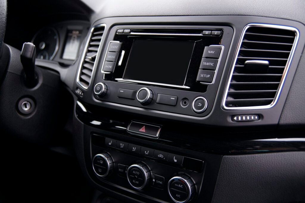 A car stereo head unit in a dashboard, the kind of screen Android Auto projects onto from older Android phones