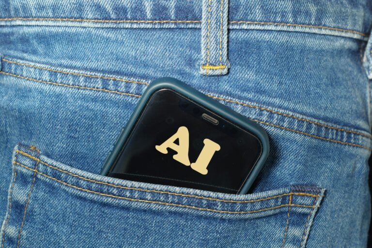 Smartphone with AI on its screen in a jeans pocket, illustrating Google's new Gemini model limits by plan