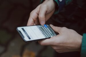 Person holding an Android smartphone, representing Pixel owners checking what their free Google AI Pro trial includes