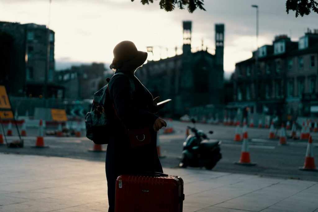A traveler checking her phone on a city street, the kind of moment the redesigned Google Translate app for Android is built for