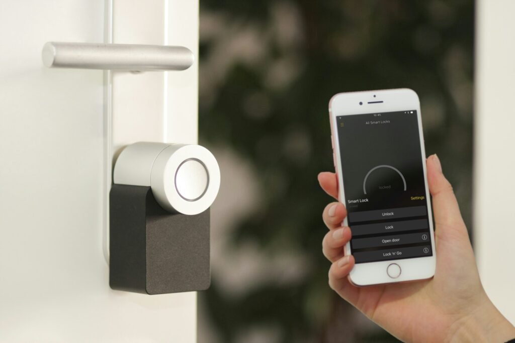 A phone app controlling a smart lock at the front door, illustrating Samsung's redesigned SmartThings app