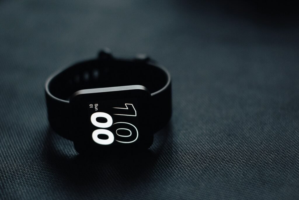 Close-up of a smartwatch resting on a table, representing the health data tracked in the Google Health app