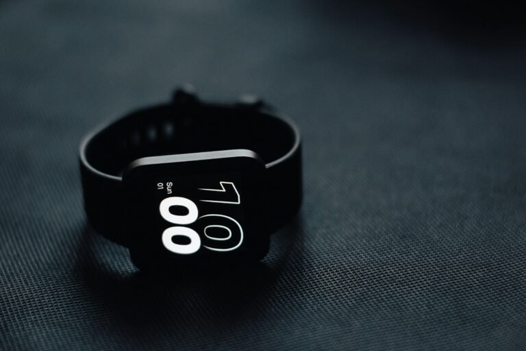 Close-up of a smartwatch resting on a table, representing the health data tracked in the Google Health app