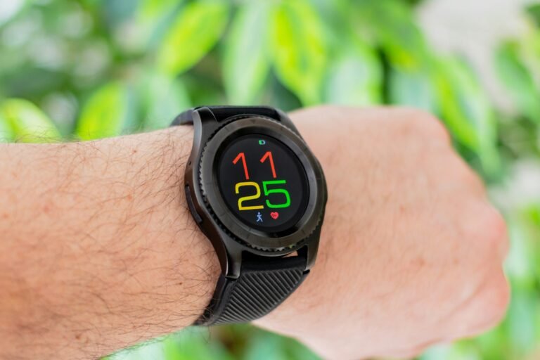 A round smartwatch on a wrist tracking health and fitness, for a Pixel Watch 5 review