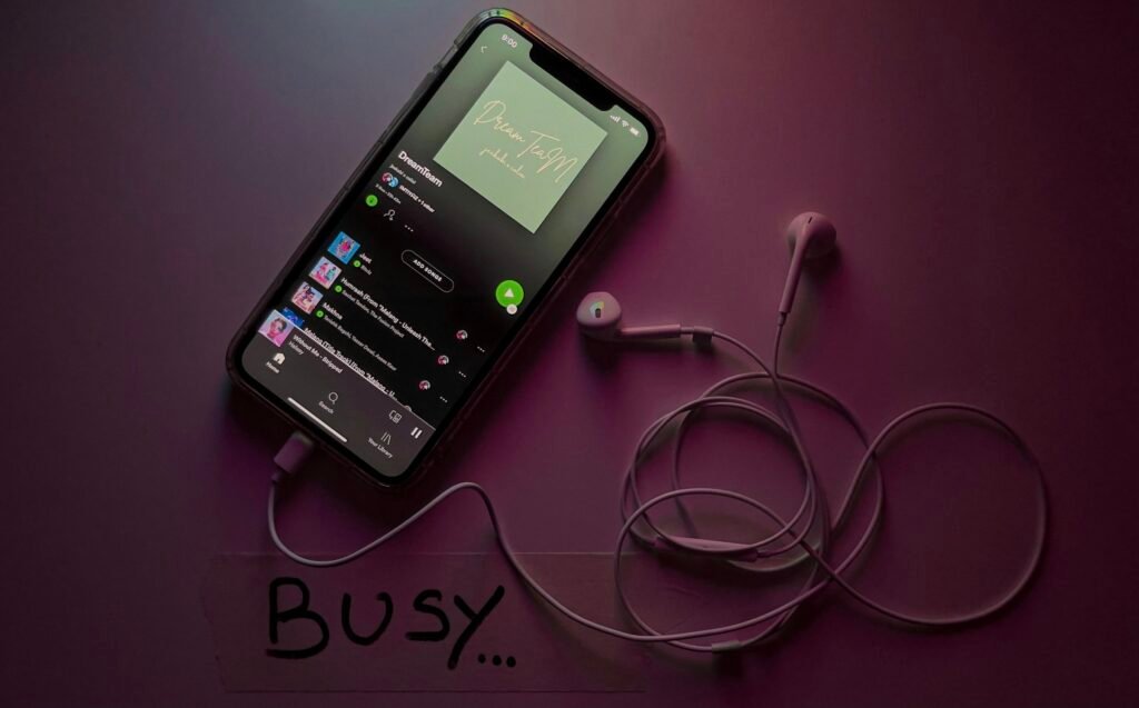 Android smartphone with a music streaming app open, illustrating Spotify's new Family plan QR code verification