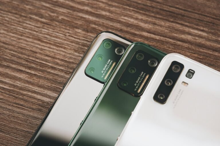 Two Samsung Android phones side by side on a wooden table, ready for transferring data from an old phone to a new one