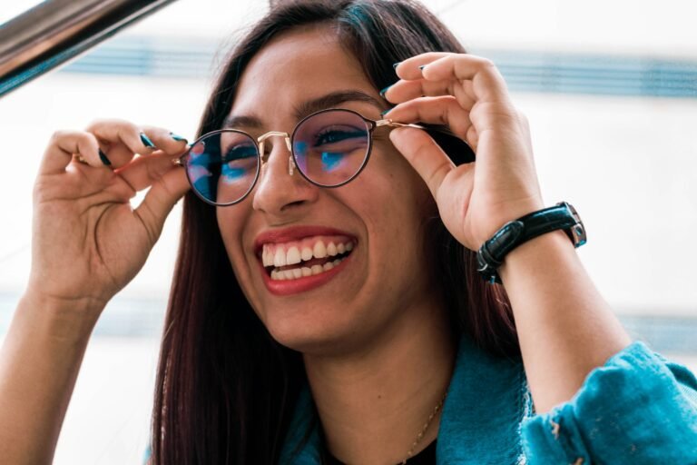 A woman wearing black-framed glasses, the everyday style Samsung's Android XR smart glasses are aiming for